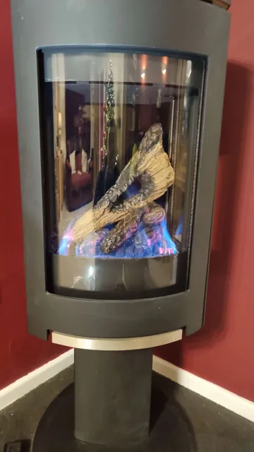 Freestanding gas fire with a visible flame display.